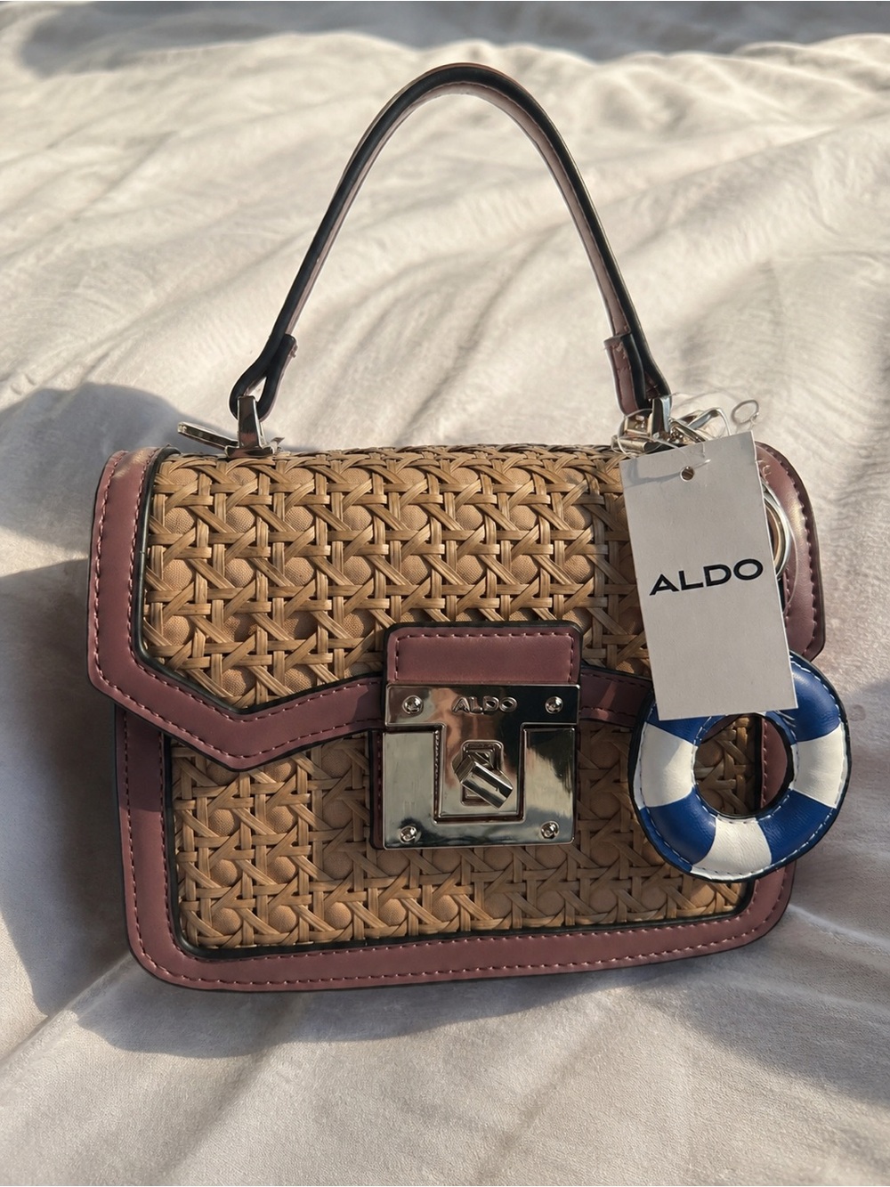 ALDO Woven Satchel with Pink Trim and Blue Charm